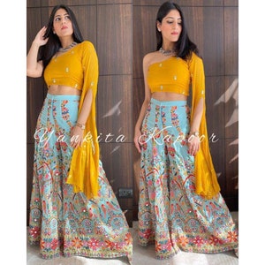 Haldi yellow stylish one shoulder blouse with sky blue heavy embroidered palazzo set crop top for haldi function yellow party wear dress