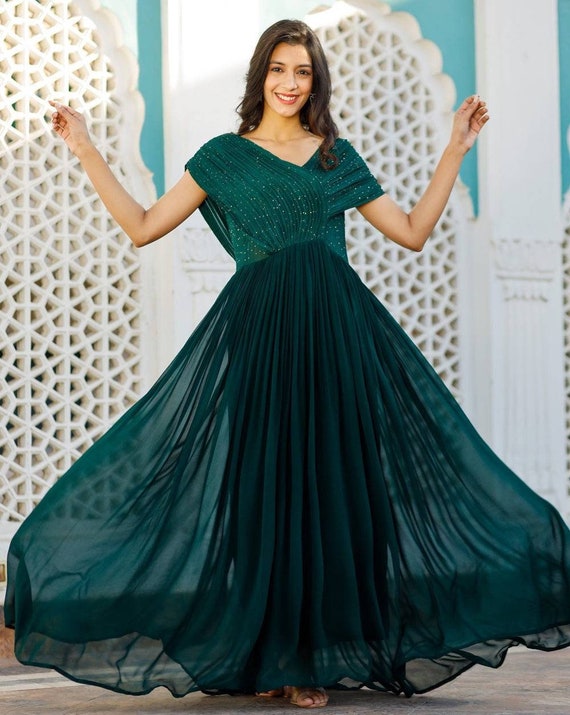 Bottle green embellished gown by Kamaali Couture