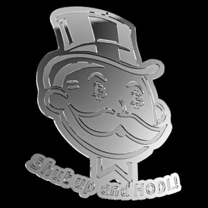 May include: A silver-coloured metal ornament depicting a cartoon character wearing a top hat and the text "Shut up and HODL!" The character has dollar signs for eyes.