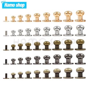 May include: Assortment of metal button snaps in various sizes and finishes, including gold, silver, and bronze. The buttons are arranged in rows, with each row featuring a different size and finish.