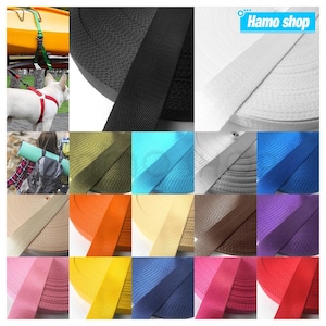 May include: A variety of colors of woven webbing straps, including black, white, khaki, orange, blue, red, yellow, green, and purple. The straps are rolled up and displayed in a grid pattern. The text "Hamo shop" is visible in the top right corner of the image.