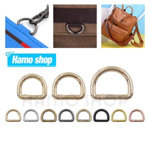 Puede incluir: Un conjunto de diez anillos en D de oro, plata, negro y oro rosa en varios tamaños. Los anillos en D se utilizan comúnmente para sujetar correas, asas u otros accesorios a bolsos, carteras y otros artículos.