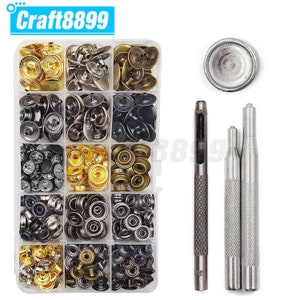 May include: A set of 120 snap fasteners in a clear plastic storage box with a variety of colours and sizes. The set also includes a metal punch and two metal tools for setting the snaps.