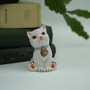 Vintage Hand Painted Porcelain Cat Figurine: Kitsch Decor with Gold Bell