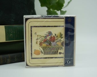 May include: A set of six coasters featuring a colorful fruit basket illustration. The coasters are packaged in a blue and gold box with the text "Pimpernel" and "Coasters 6" printed on it.