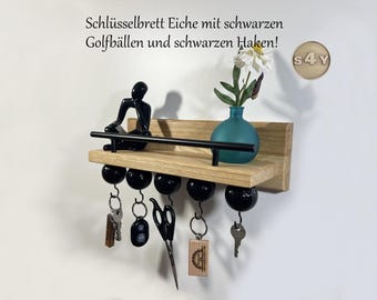 Key rack/shelf made of solid rustic oak with 5 black golf balls, black screw hooks, letter holder edge, black personalization