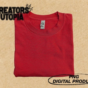 May include: A folded red t-shirt with a crew neck. PNG DIGITAL PRODUCT.