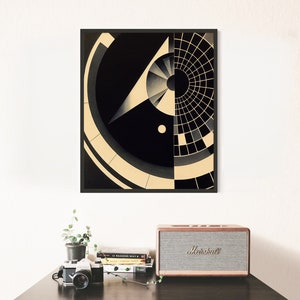 Puede incluir: Impresi&oacute;n de arte geom&eacute;trico abstracto con formas negras y blancas y un dise&ntilde;o circular. La impresi&oacute;n est&aacute; enmarcada en un marco negro.