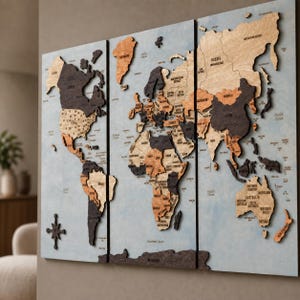 May include: A three-panel wooden world map wall art piece featuring raised, laser-cut continents in varying shades of brown, black, and natural wood tones. The map is set against a light blue background with engraved country names and borders.