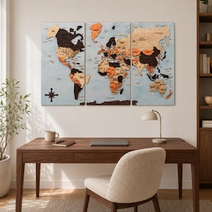 May include: A three-panel wooden world map wall art piece featuring continents in varying shades of brown, tan, and orange against a light blue background. The map includes a dark brown compass rose in the lower left corner and text labels.