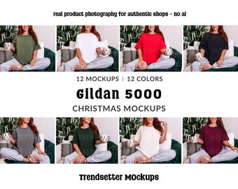 May include: A product mockup featuring eight different colored Gildan 5000 t-shirts. The shirts are displayed on a model sitting on a couch with Christmas decorations. Text on the image reads "Gildan 5000 Christmas Mockups" and "Trendsetter Mockups."