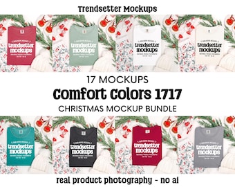 May include: A mockup bundle featuring various colored t-shirts, including red, green, white, and gray, arranged with Christmas-themed decorations. The shirts display the text "trendsetter mockups." The image also includes the text "17 MOCKUPS," "comfort colors 1717," and "CHRISTMAS MOCKUP BUNDLE."