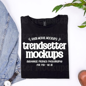 May include: A black t-shirt with the text "trendsetter mockups" in white, along with the words "REAL-MODEL MOCKUPS" and "AUTHENTIC PRODUCT PHOTOGRAPHY FOR POD NO AI". A denim jacket, a watch, and brown leather shoes are also visible.