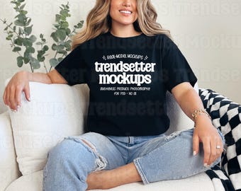 May include: A black short-sleeve t-shirt featuring white text that reads "real-model mockups", "trendsetter mockups", and "authentic product photography for pod - no ai" with small star accents printed on the front chest area.