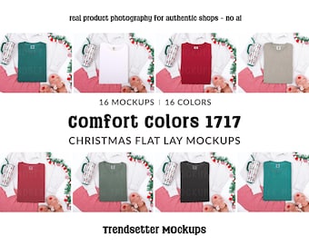 May include: A flat lay product mockup featuring various colored t-shirts, pajamas, mugs, and slippers. The image includes the text "Comfort Colors 1717" and "Christmas Flat Lay Mockups". The background is white with Christmas decorations.