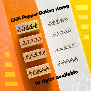 May include: Wooden stamps with chili pepper and flame designs. The stamps are arranged with corresponding pepper and flame graphics. Text reads "Chili Pepper Rating stamp" and "10 styles available". The background is orange and yellow.