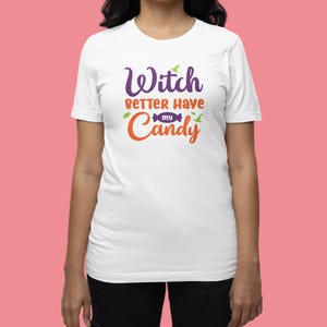 May include: White t-shirt with the text "Witch Better Have My Candy" in orange, purple, and green lettering. The text is surrounded by small witch hat and candy graphics.