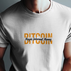 May include: White t-shirt with the text "BITCOIN Magic Internet Money" in orange and black lettering.