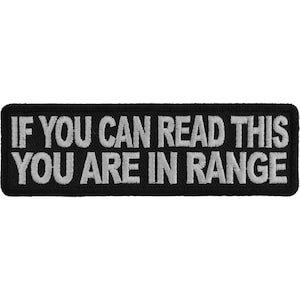 May include: Black and white embroidered patch with the text "If you can read this you are in range".