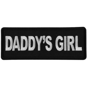 May include: White embroidered text on a black patch that reads "Daddy's Girl".