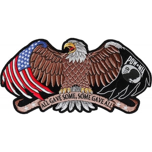 May include: An embroidered patch featuring a bald eagle with outstretched wings, holding an American flag in one wing and a POW MIA flag in the other. The eagle is perched on a banner that reads "All Gave Some, Some Gave All".