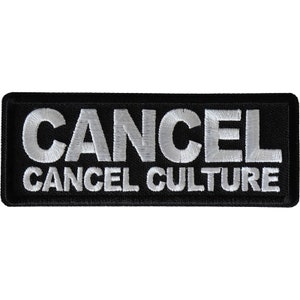 May include: Black embroidered patch with white text that reads "CANCEL CANCEL CULTURE".