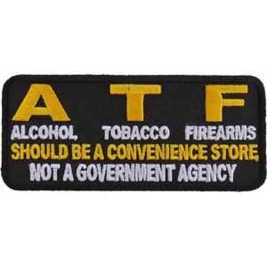 May include: Black embroidered patch with yellow letters spelling ATF, which stands for Alcohol, Tobacco, Firearms. The text below reads "Should be a convenience store, not a government agency."