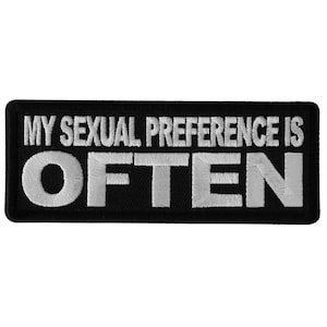 May include: Black embroidered patch with white text that reads "My sexual preference is often".