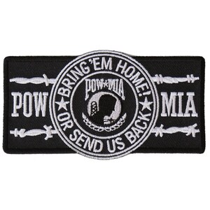 May include: Black and white embroidered patch with the text "Bring 'em Home! POW or Send Us Back" and a POW/MIA logo with a silhouette of a soldier's head. The patch is surrounded by barbed wire.