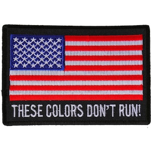 May include: An embroidered patch with an American flag and the text "These Colors Don't Run!"