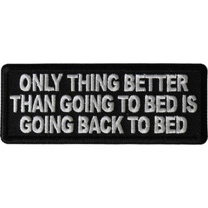 May include: Black embroidered patch with white text that reads "Only thing better than going to bed is going back to bed."