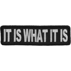 May include: Black embroidered patch with white text that reads "IT IS WHAT IT IS".
