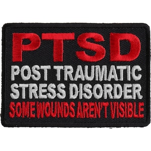 May include: Black embroidered patch with red and white lettering. The patch reads "PTSD Post Traumatic Stress Disorder Some Wounds Aren't Visible".