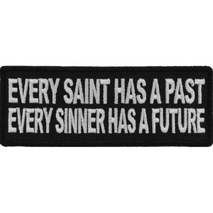 May include: Black embroidered patch with white text that reads "Every Saint Has A Past Every Sinner Has A Future".