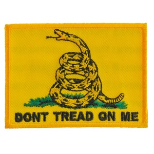 May include: A yellow embroidered patch with a coiled snake and the words "Don't Tread On Me".