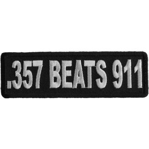 May include: Black embroidered patch with white text that reads "357 Beats 911".