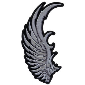 May include: A silver embroidered patch with a stylized wing design. The wing is detailed with intricate lines and curves, creating a tribal or gothic aesthetic.