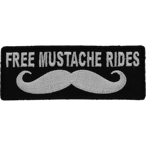 May include: Black and white embroidered patch with the text "FREE MUSTACHE RIDES" and a white mustache.