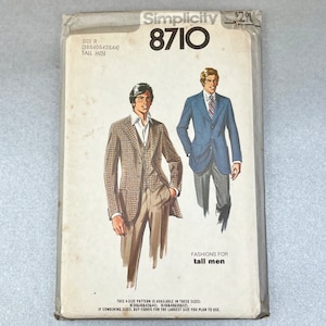 May include: Simplicity sewing pattern number 8710 for tall men's clothing. The pattern includes instructions for a plaid blazer and a solid blue blazer.