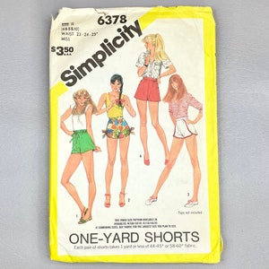 May include: Simplicity sewing pattern number 6378 for one-yard shorts. The pattern includes three sizes: 23, 24, and 25 inches. The pattern shows four women wearing different styles of shorts.