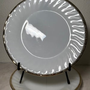 Fire King (2) Dinner Plates 9” Smooth, Swirl Design Gold Rim 1950s VGUC Vintage. Very good used condition. No cracks or chips. Please see cl
