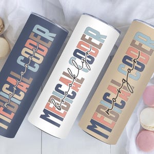 May include: Three stainless steel tumblers with different colored backgrounds and the text "MEDICAL CODER" in a colorful, stylized font. The text on the tumblers reads "MEDICAL CODER -  more than a job", "MEDICAL CODER -  work of life", and "MEDICAL CODER -  making a difference".