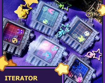 May include: Five gray shaker charms with different colorful designs inside. The charms are shaped like small rectangular screens with a black border. The text "ITERATOR SHAKER CHARMS" is at the bottom of the image.