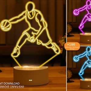 May include: A 3D printed night light featuring a basketball player dribbling a ball. The light is available in yellow, blue, and purple. The image also includes the text "+100 Customize Different Design".