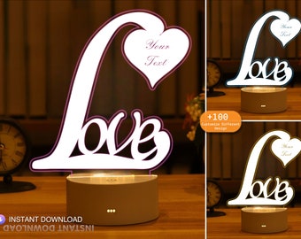 May include: A white 3D printed night light shaped like the word "love" with a heart on top. The heart has the text "Your Text" inside. The night light is on a white base with three small dots on the front. The image shows three different color variations of the night light.