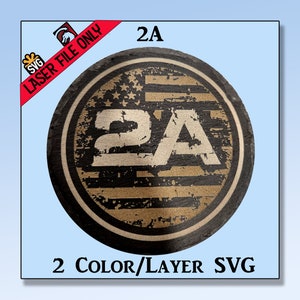 May include: A round, distressed, black and gold sticker with the text "2A" in a bold, white font. The sticker has a distressed American flag design with white stars on a blue background and red and white stripes. The text "2A" is centered on the sticker.