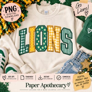 May include: A cream-coloured crewneck sweatshirt featuring the word LIONS in large, block-style letters. Each letter has a unique pattern: green gingham, yellow polka dots, green with white daisies, yellow gingham, and green with white stripes.