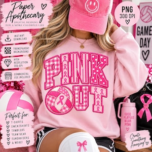 Op de afbeelding: Een lichtroze sweatshirt met de tekst PINK OUT in grote blokletters met diverse roze patronen, waaronder vichy, stippen en lintjes voor borstkankerbewustzijn. Een volleybalafbeelding is verwerkt in de letter O.
