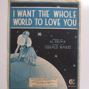 Könnte beinhalten: Ein Vintage-Notenblatt mit blauem und schwarzem Hintergrund. Das Cover zeigt eine Frau in einem weißen Pelzmantel, die auf einem Globus sitzt. Der Titel des Liedes ist "I Want The Whole World To Love You" von Al Bryan und Gerald Marks. Die Noten werden von The Sun Music Publishing Co. Ltd. und Donaldson, Douglas & Gumble, Inc. veröffentlicht.