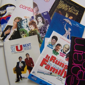 May include: A selection of theatre programmes and brochures, displaying diverse covers. The programmes feature actors and play titles, with varied colours and fonts. Some include the text "SEE U NEXT TUESDAY" and "It Runs in the Family."